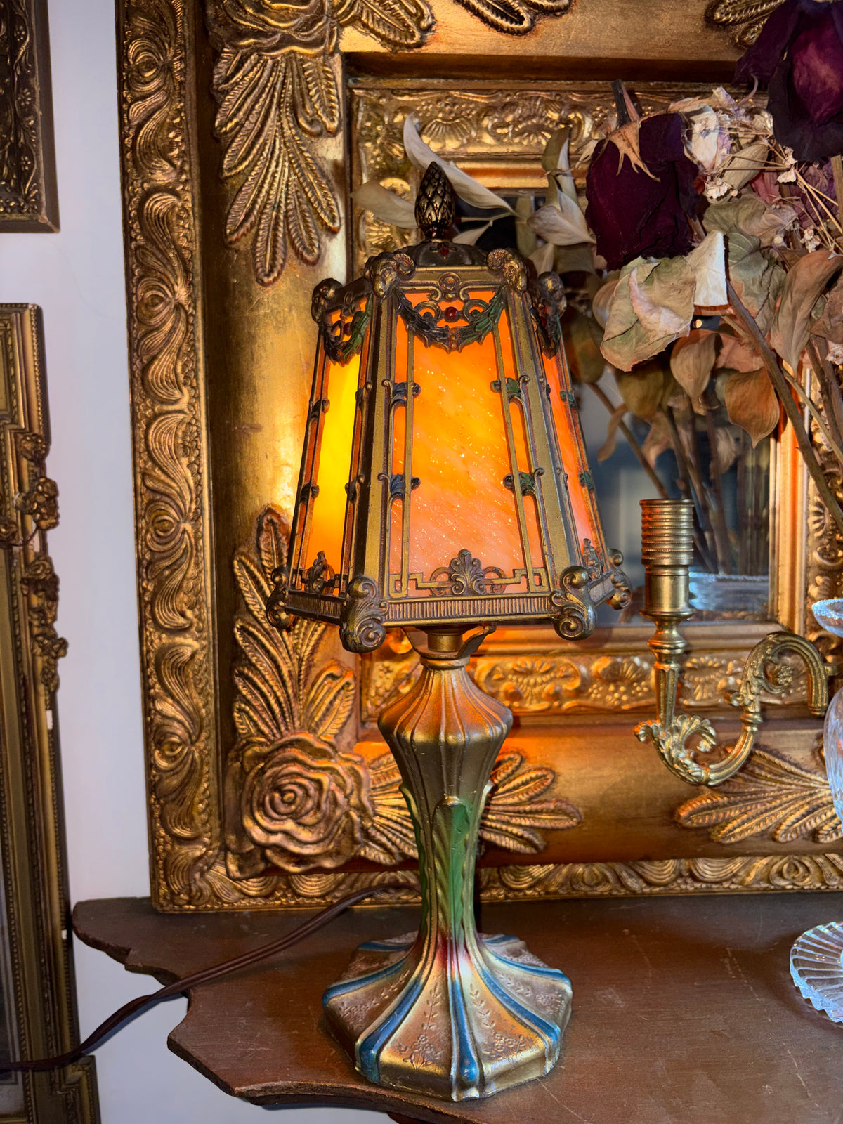Art Nouveau style jeweled table lamp with slag glass and Ram head Motifs